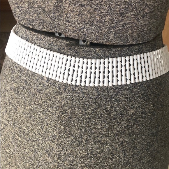 Vintage 1970s white plastic adjustable belt.